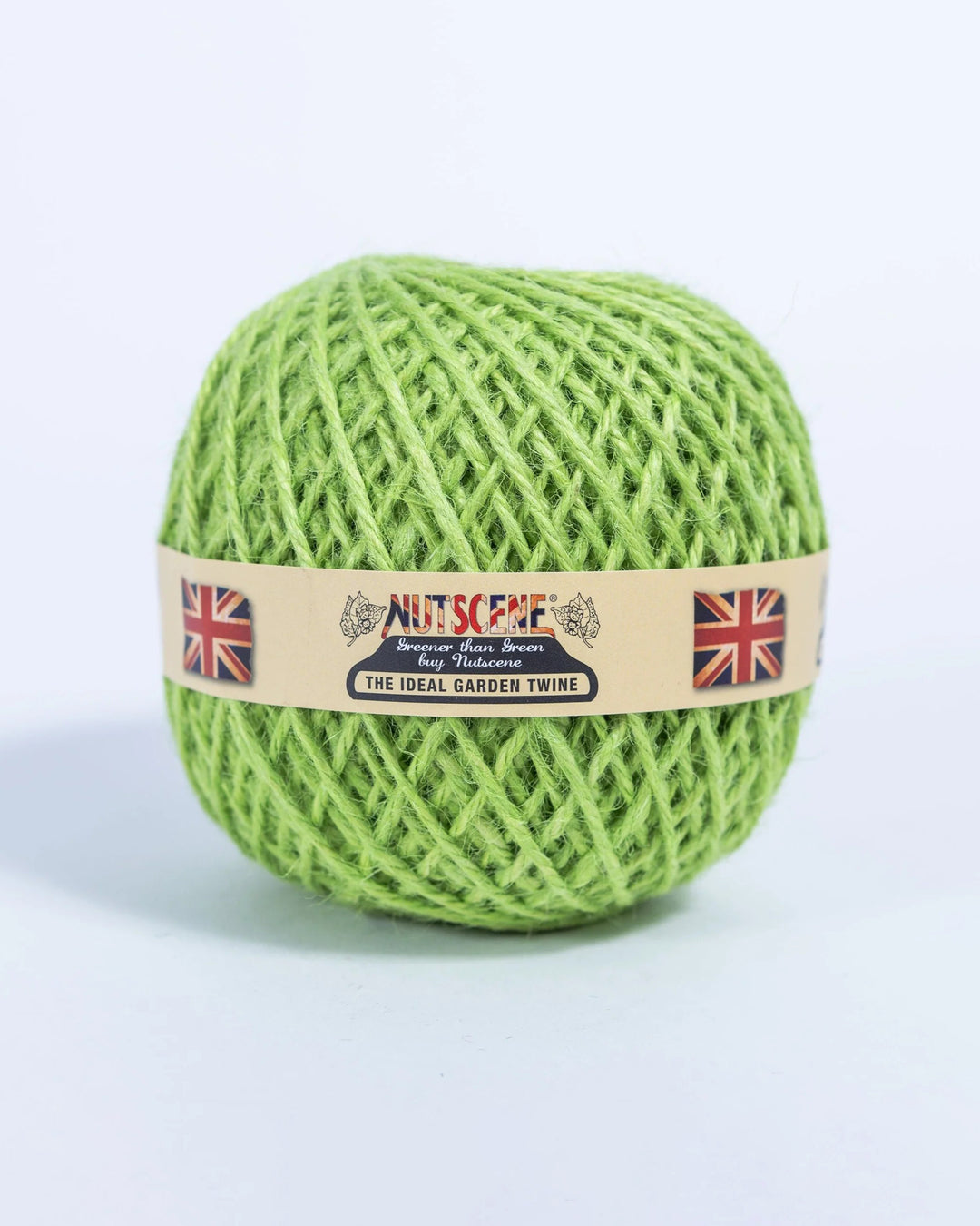 Green ball of twine with a Nutscare label on a light gray background
