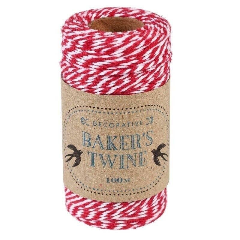 Roll of red and white baker's twine on a cardboard tube with decorative text.