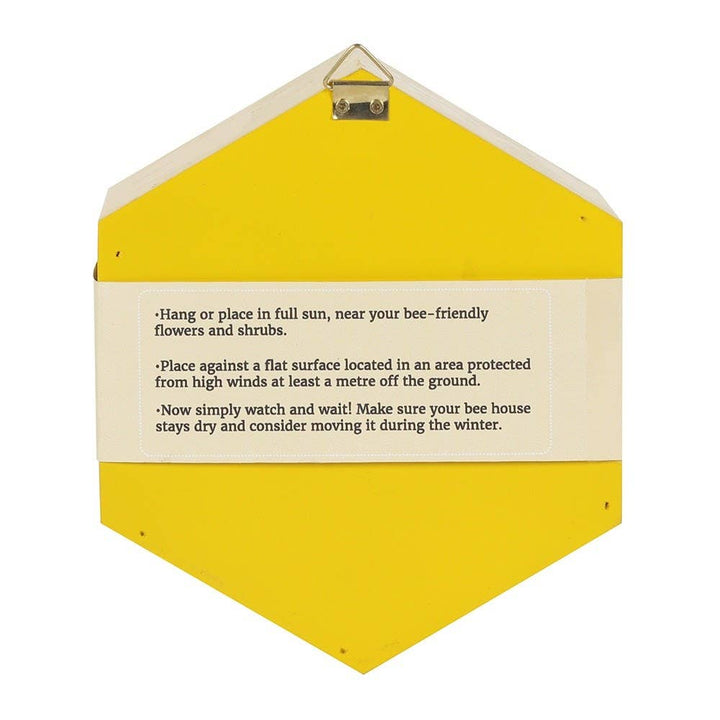 Yellow bee house with instructions on a white background