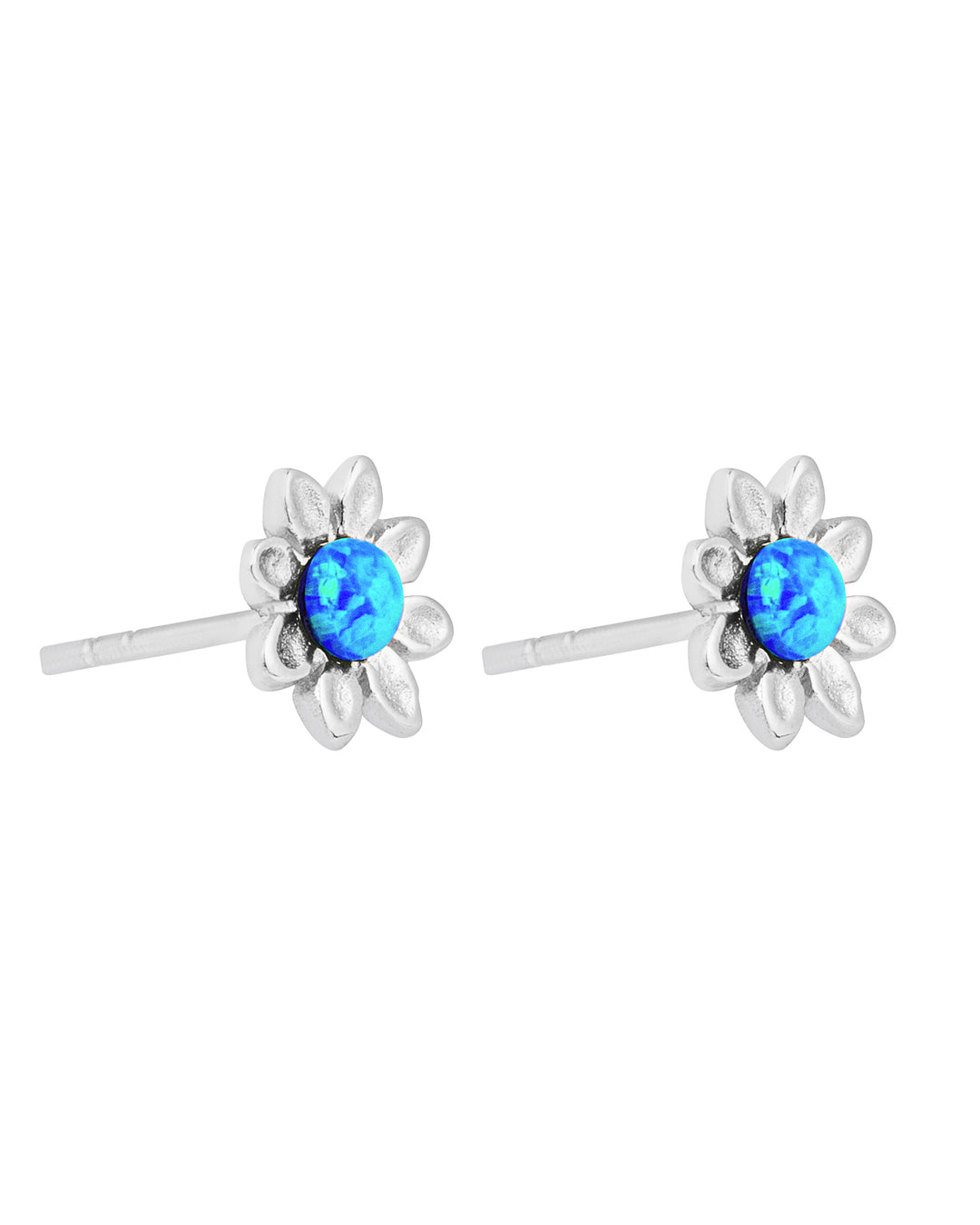 Silver flower-shaped earrings with blue gemstones on a white background