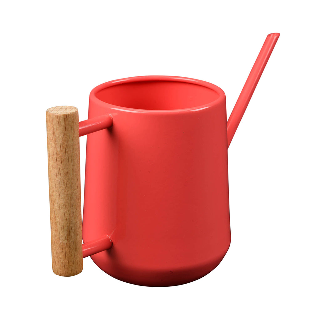 Coral watering can with wooden handle and straw on a white background
