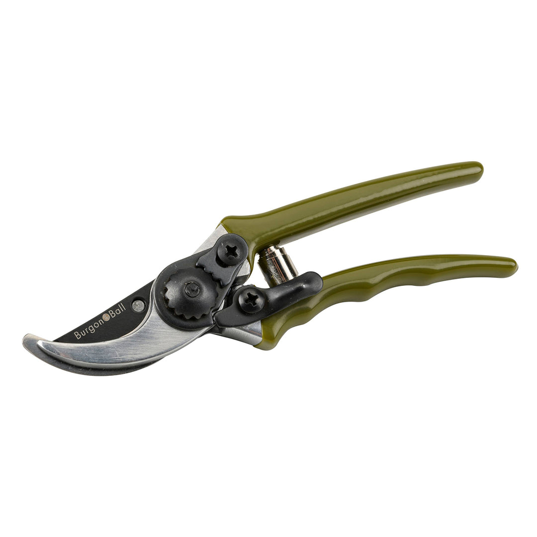 Gardening pruner with green handles on a white background