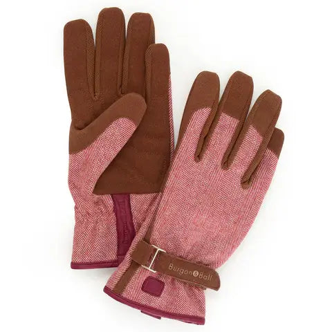 Pair of gloves with brown and pink pattern on a white background