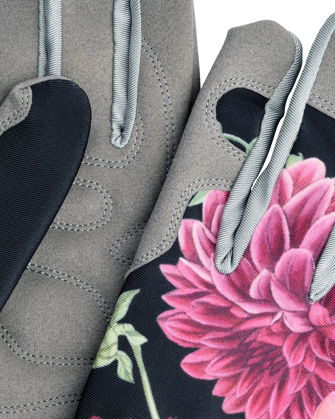 Gray glove with pink floral design on a black background