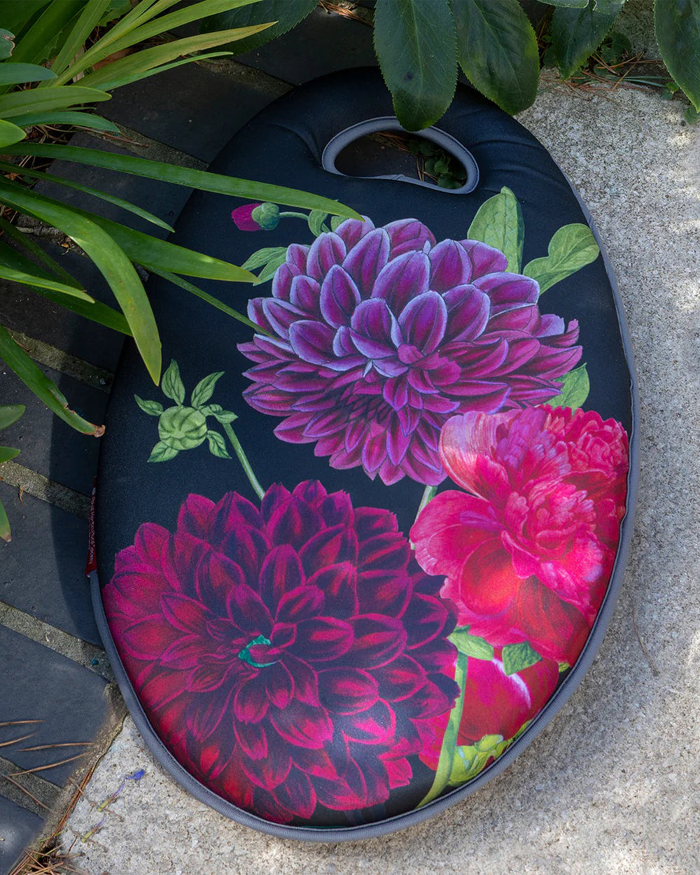 Floral-patterned product on a stone surface with greenery