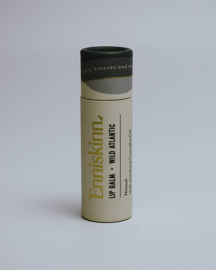 Lip balm tube with 'Ernéskinn' branding on a light gray background