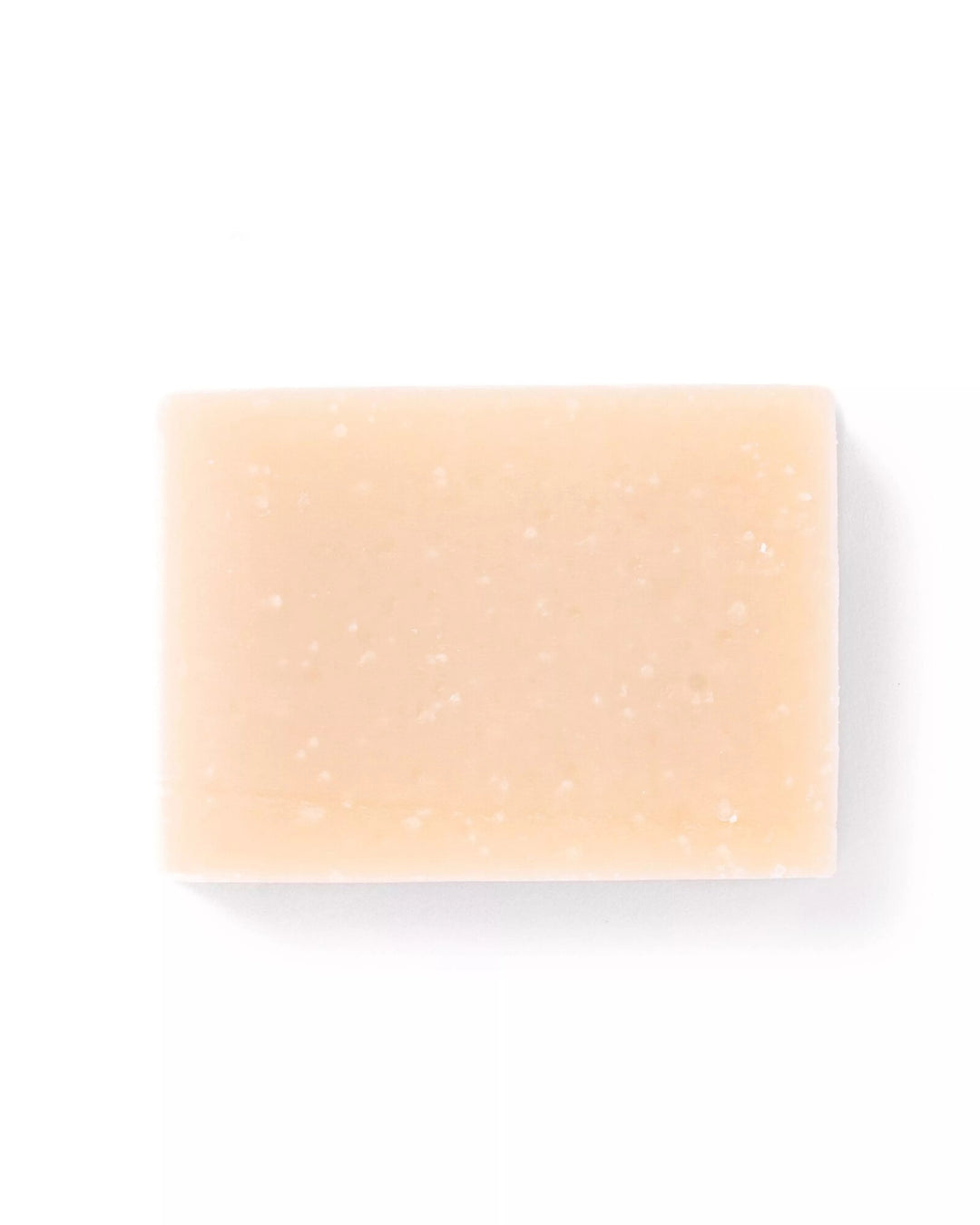 Beige soap bar on a white background
