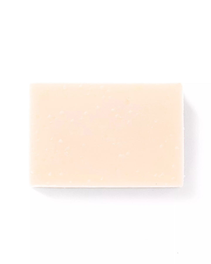 Rectangular beige soap bar on a white background