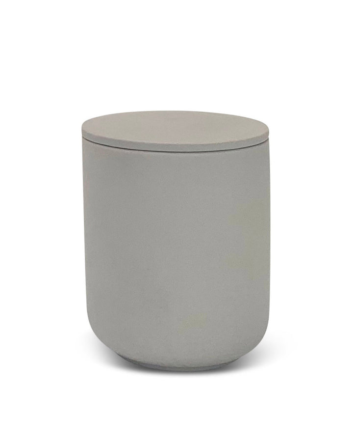 Gray cylindrical container with lid on a white background