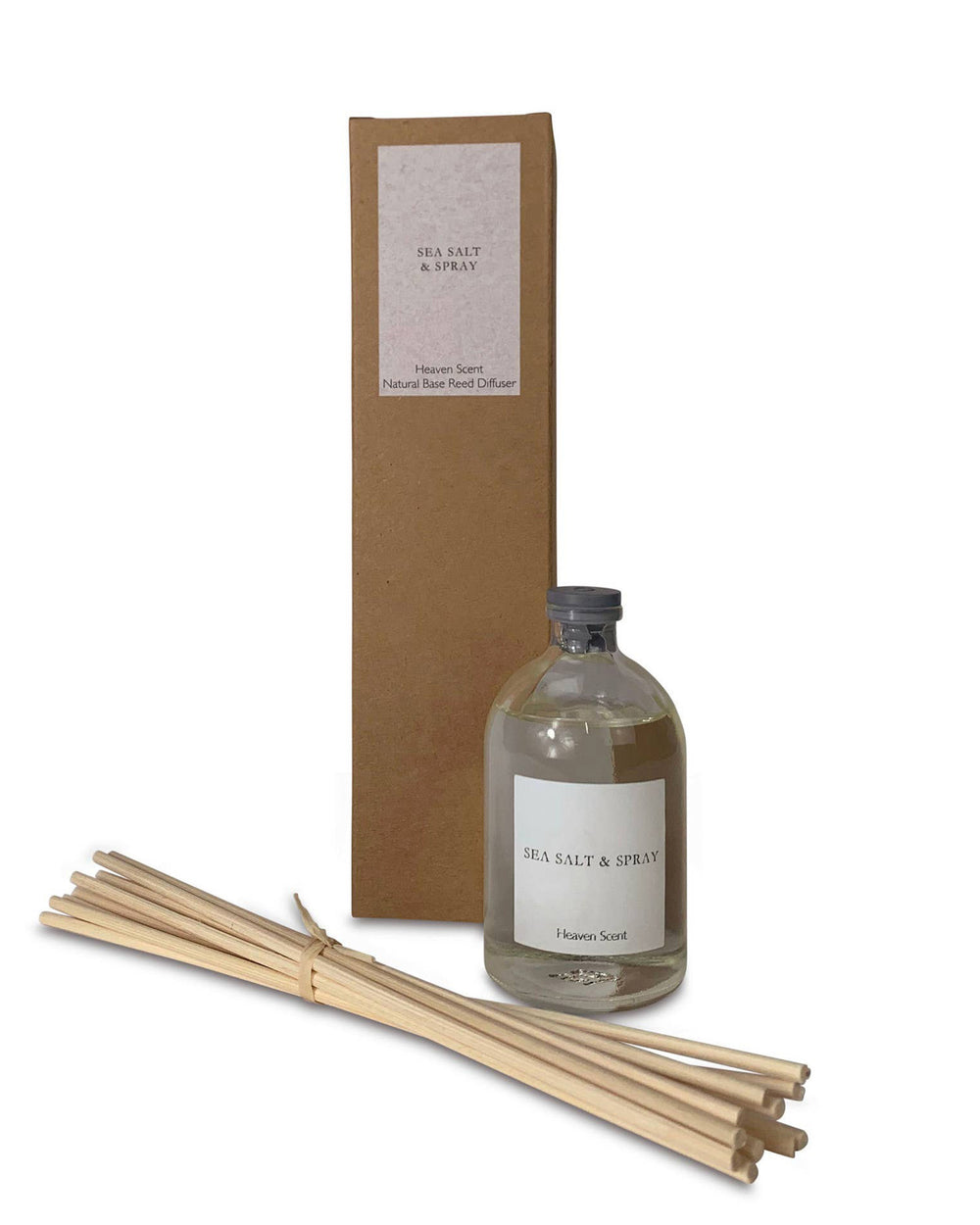 Diffuser bottle with reeds and packaging on a white background
