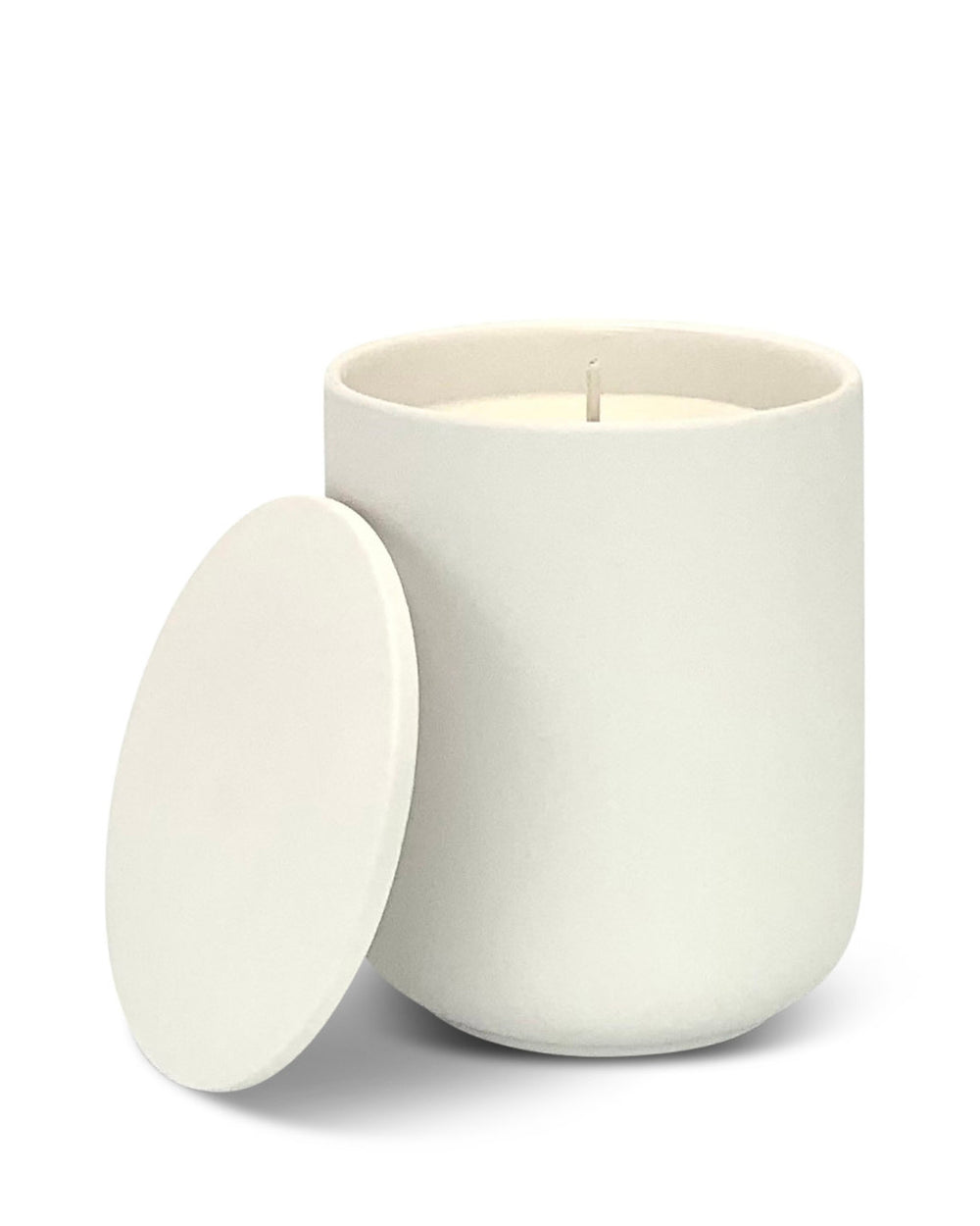 White ceramic candle with lid on a white background