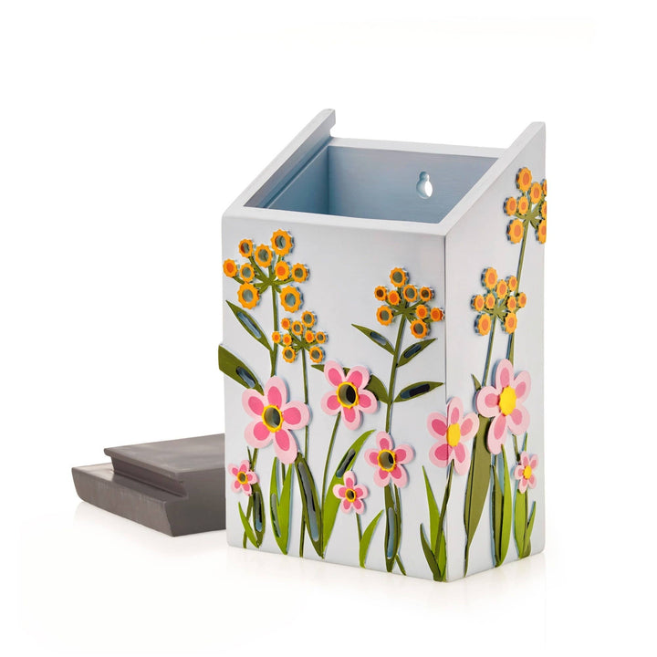 Insect house with floral design on a white background