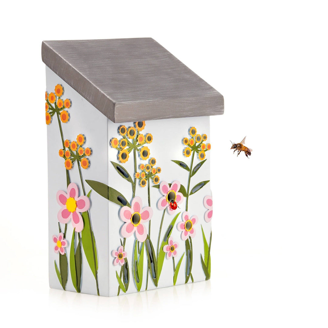 Insect house with floral design and bee on a white background