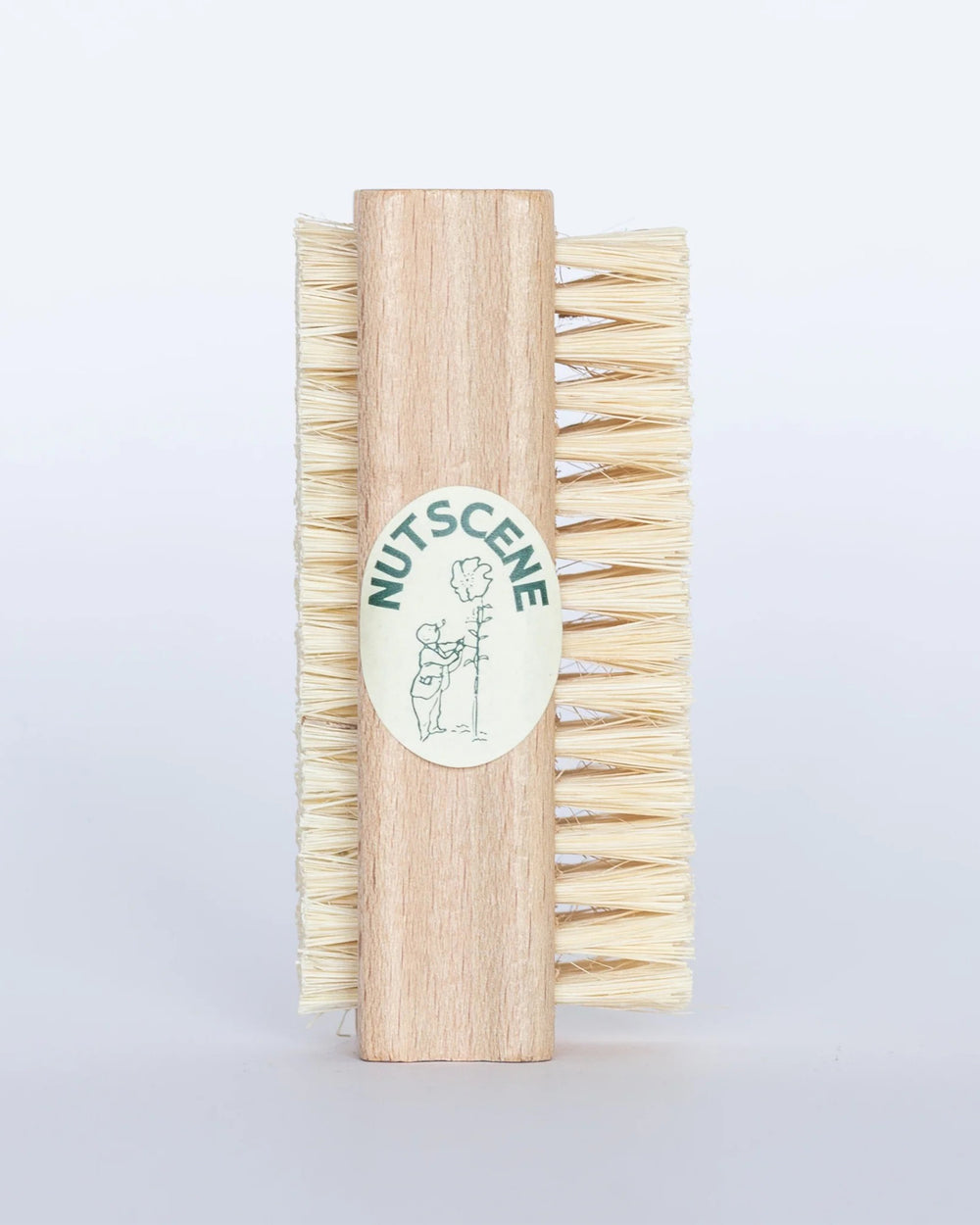 Wooden brush with bristles and a visible brand logo on a light gray background