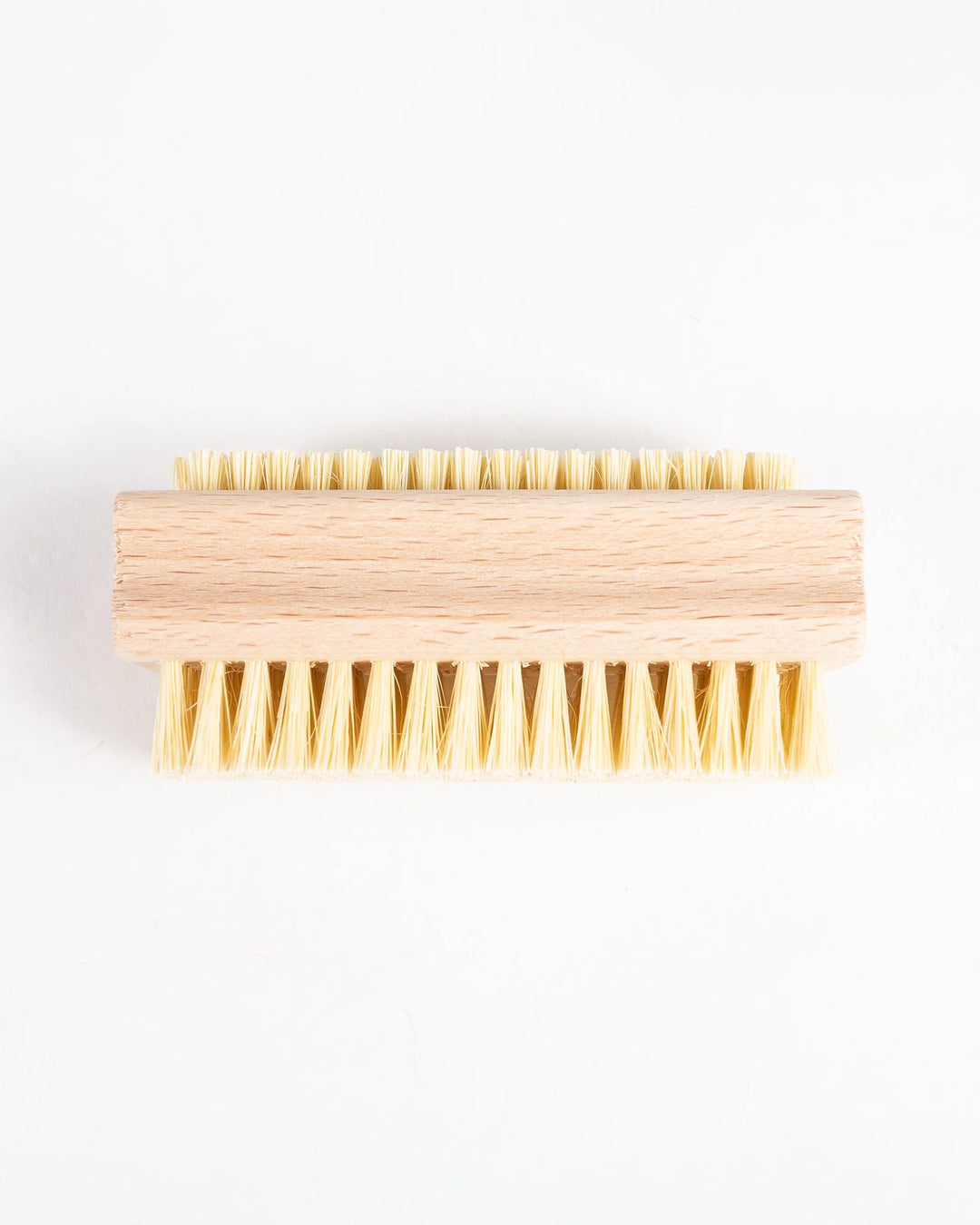 Wooden brush with bristles on a white background