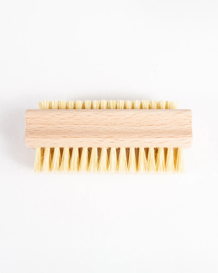 Wooden brush with bristles on a white background