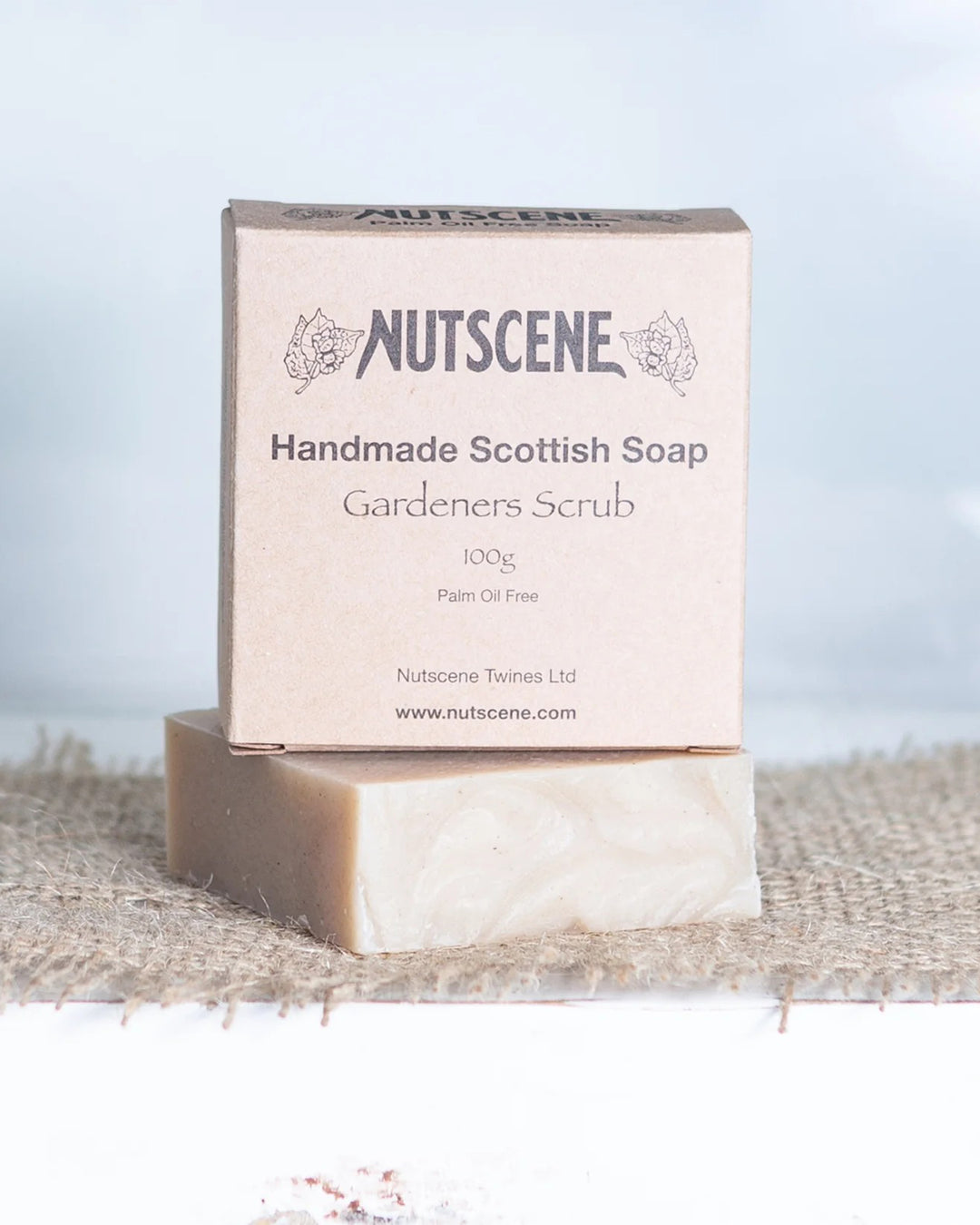 NUTSCENE handmade Scottish soap bar and packaging on a textured surface with a light background