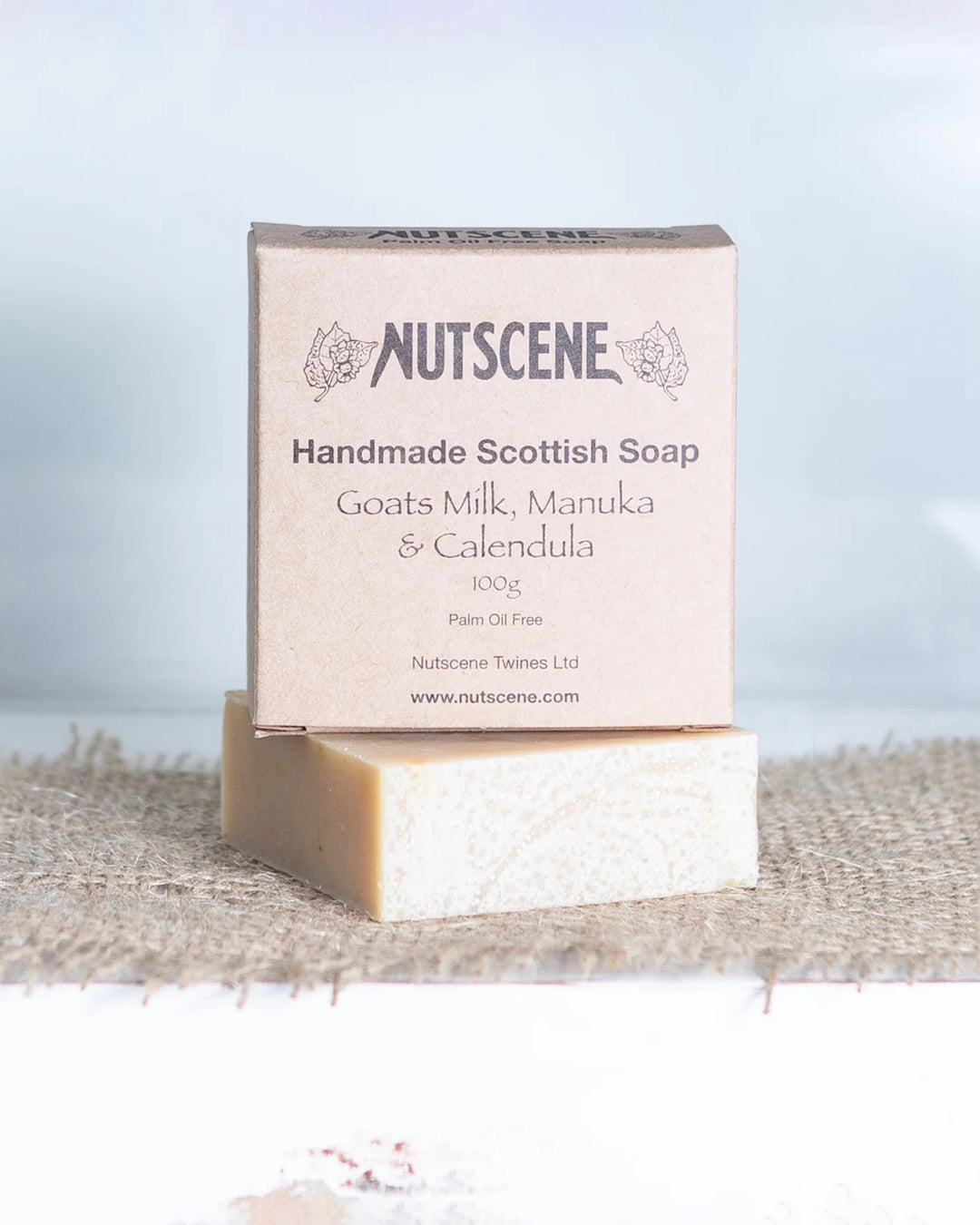 Handmade Scottish soap with Nutscene packaging on a textured surface
