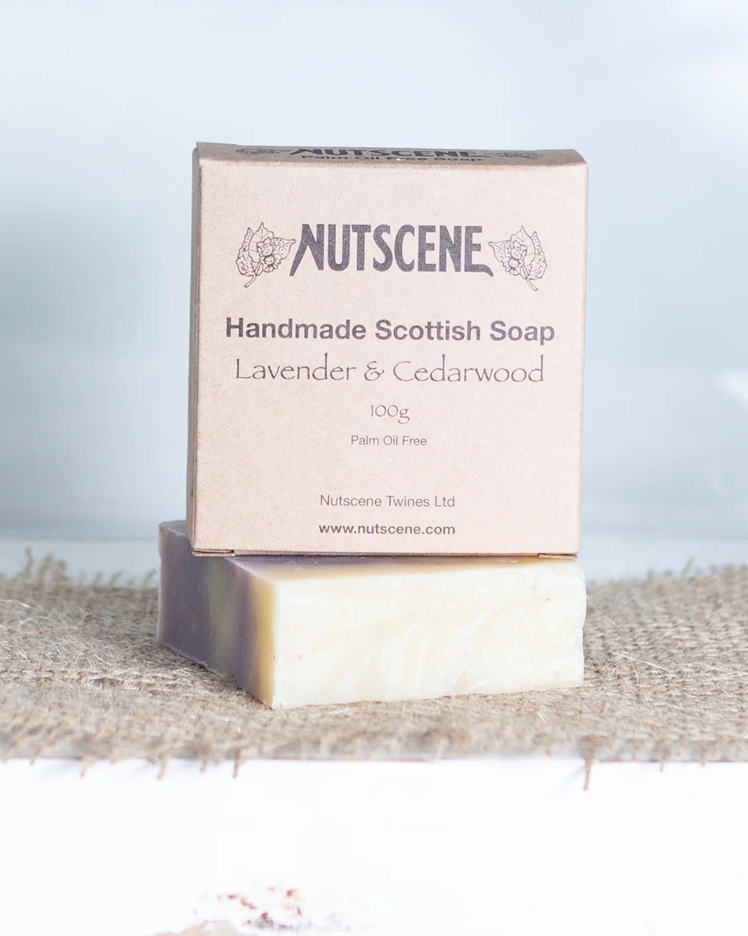 Nutsccene handmade Scottish soap with lavender and cedarwood scent on a textured surface.