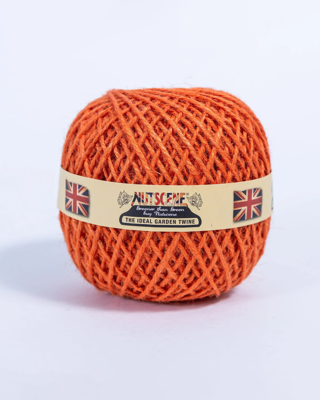 Orange ball of twine with a label on a white background