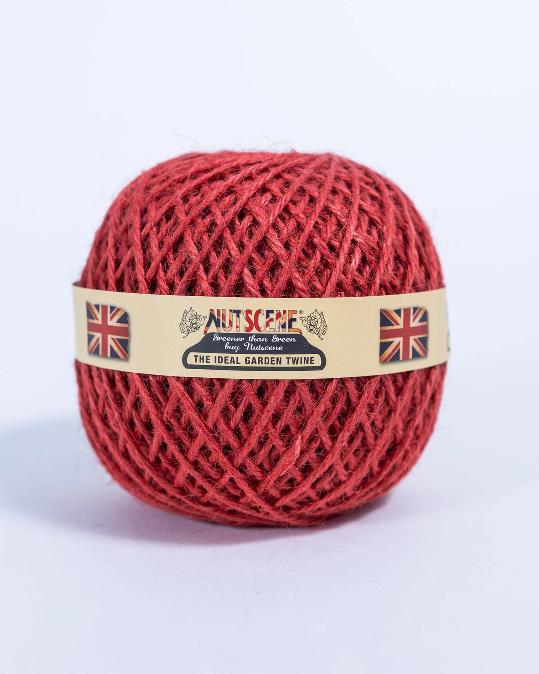 Red ball of twine with a label on a white background