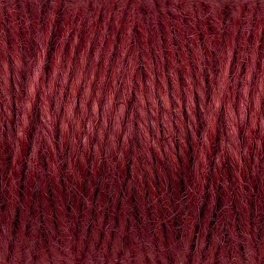Close view of Nutscene red 3 ply jute twine showing the fibre texture and colour