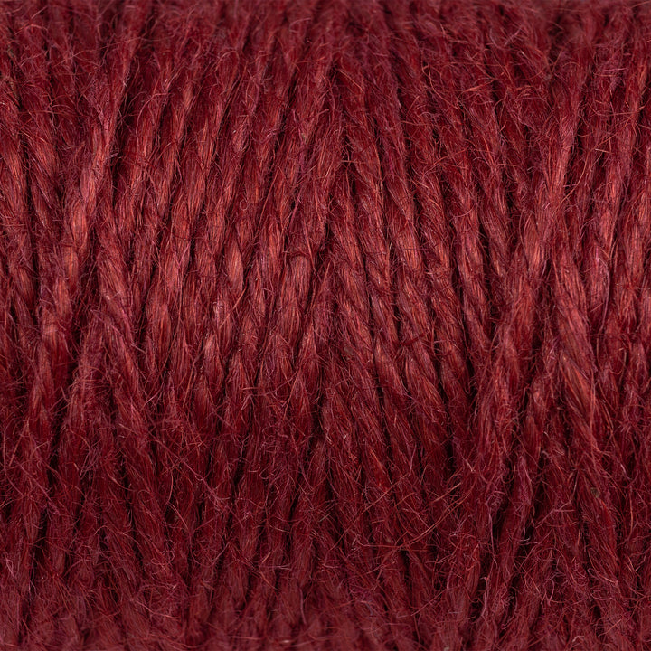 Close view of Nutscene red 3 ply jute twine showing the fibre texture and colour