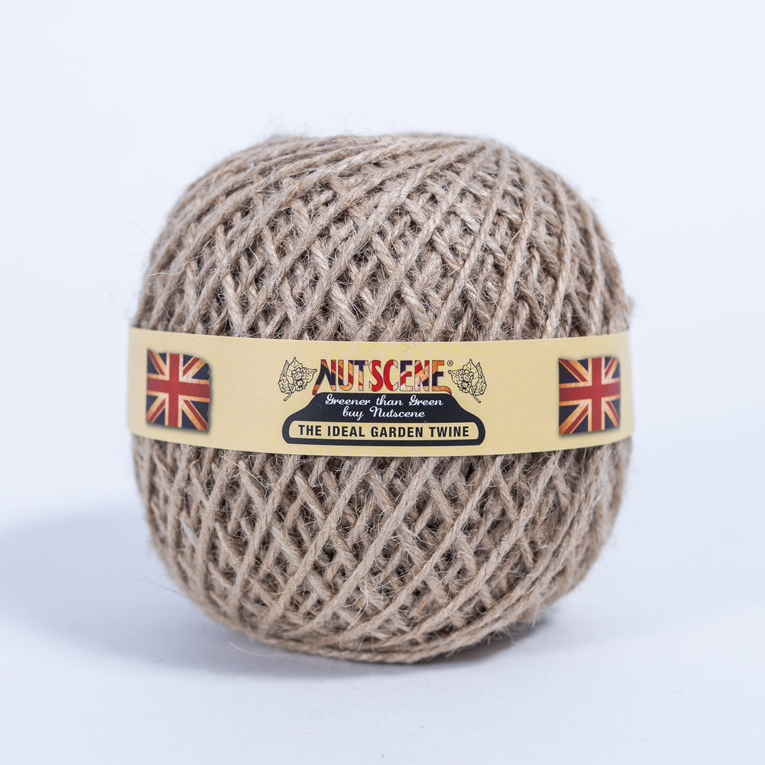Ball of Nutscene natural jute garden twine with the Nutscene paper band, the colour supplied with this wooden twine holder
