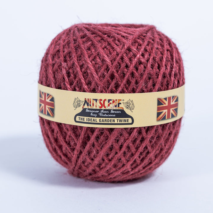 Ball of Nutscene red jute garden twine with the Nutscene paper band, the colour supplied with this wooden twine holder