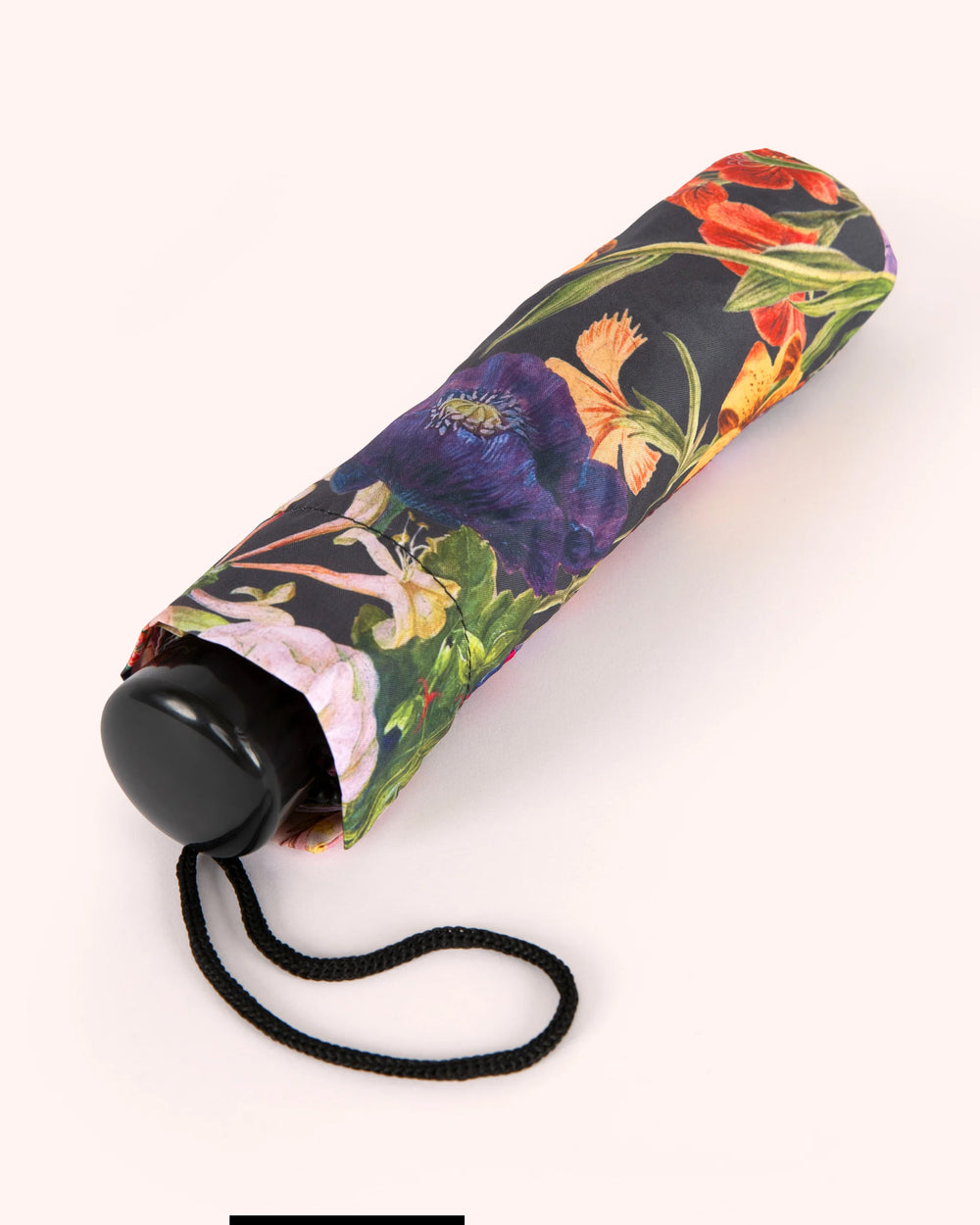 Floral-patterned umbrella on a white background