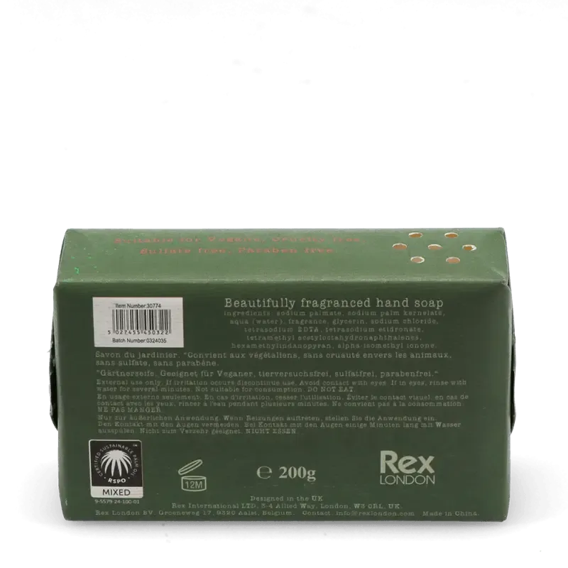 Unwrapped Rustic Fields soap bar beside its illustrated packaging