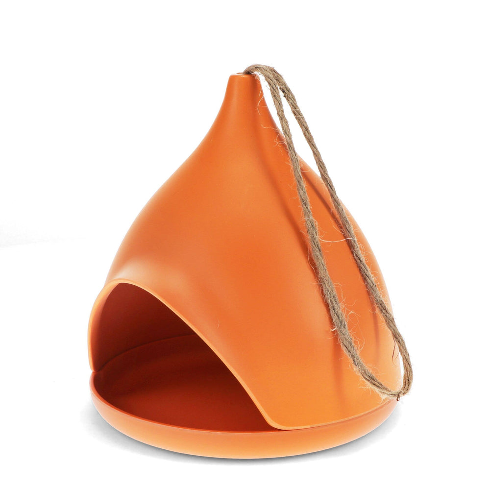 Orange hanging bird feeder with a string on a white background
