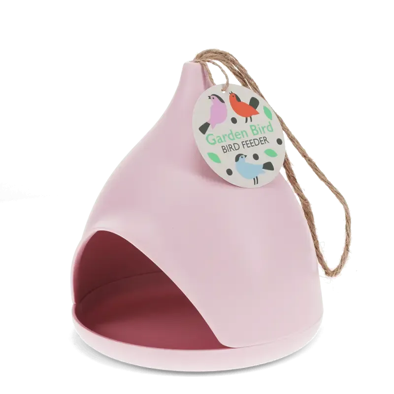 Pink bamboo fibre bird feeder with rope hanger on a white background