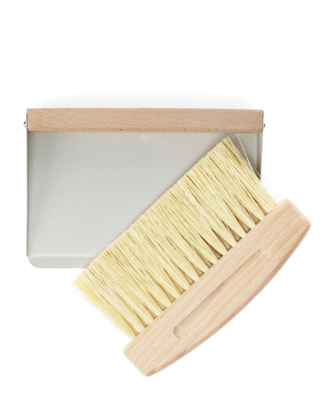 Cleaning brush with wooden handle and metal base on a white background