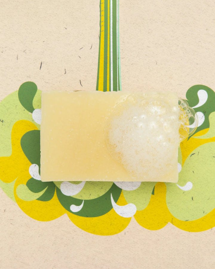 Bar of soap with a green and yellow decorative background