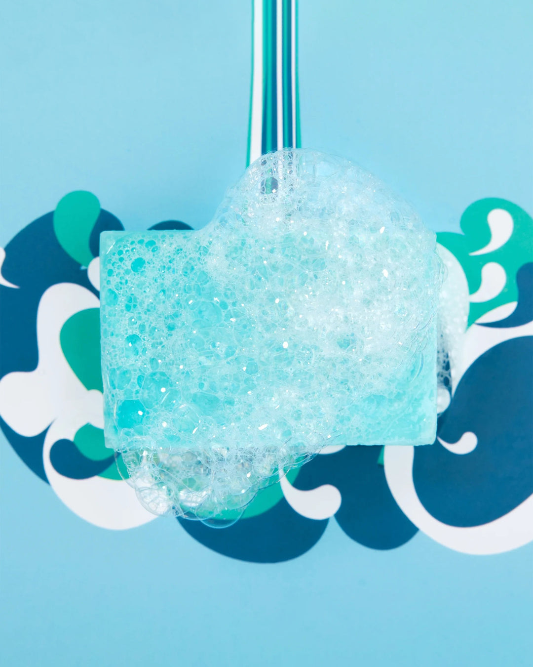 Foamy blue product with a blue background featuring wave designs