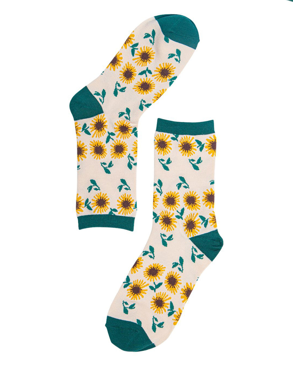 Pair of socks with sunflower pattern on a white background
