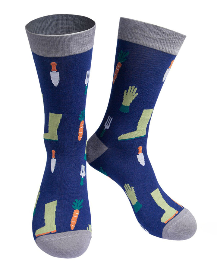 Pair of blue socks with gardening-themed designs on a white background