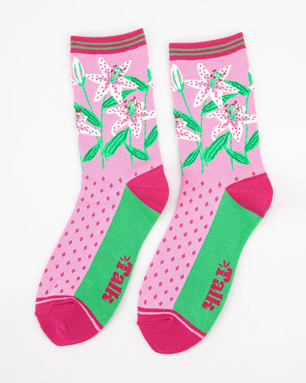 Pink socks with floral design and green accents on a white background