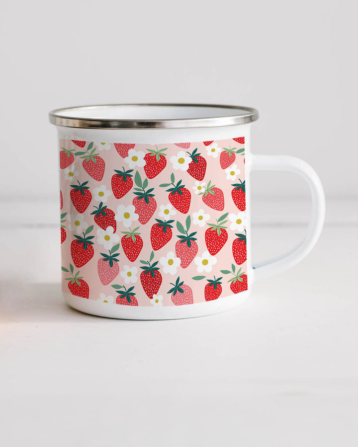 Enamel mug with strawberry pattern on a white background