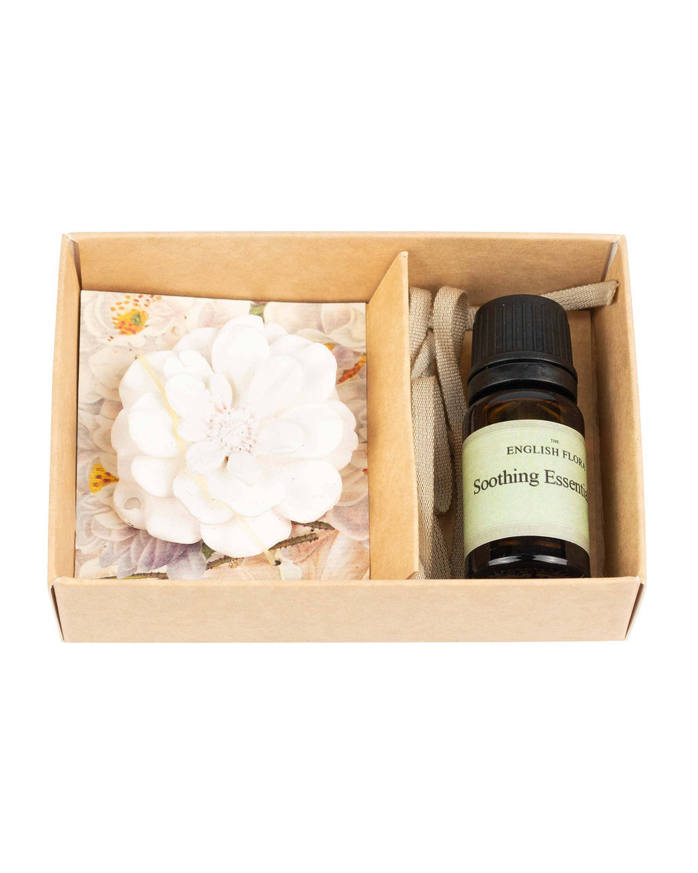 Gift set with a bottle labeled 'English Floral' and a decorative item in a cardboard box on a white background