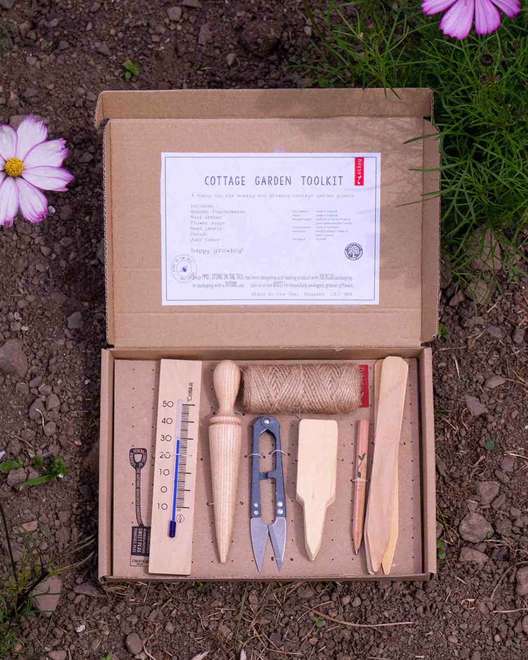Cottage Garden Toolkit with tools and instructions on a natural background
