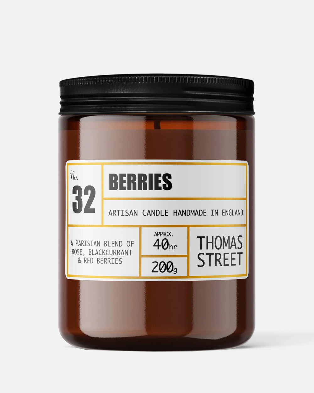 Artisan candle labeled 'Berries' by Thomas Street on a white background
