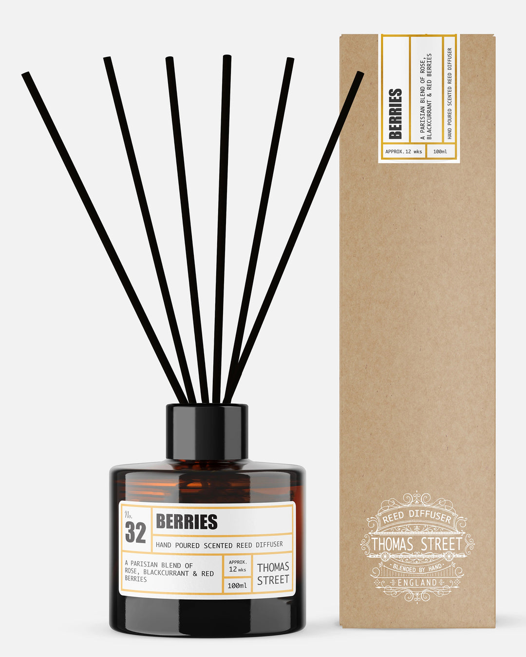 Reed diffuser labeled 'Berries' by Thomas Street with a cardboard box in the background.
