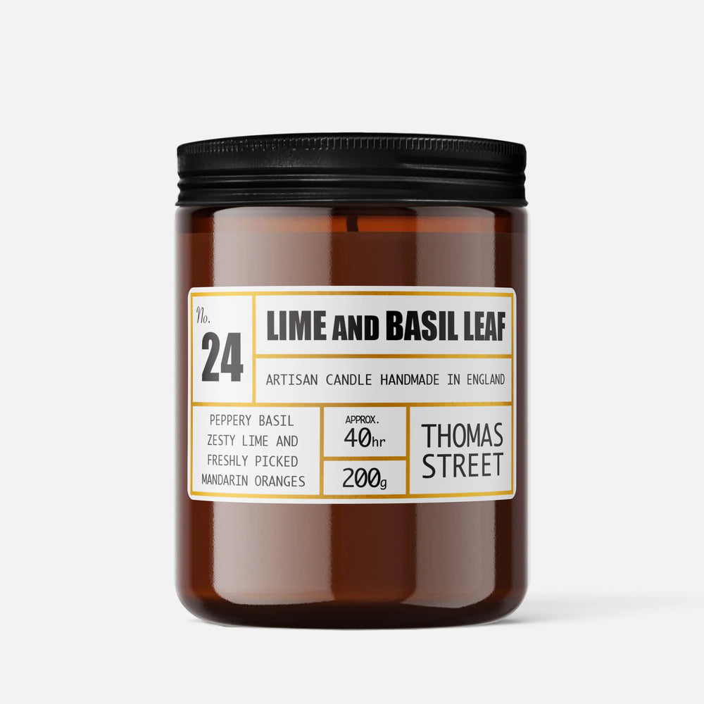 Brown candle jar with black lid and 'Thomas Street' label on a white background