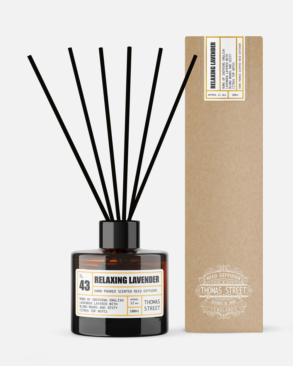 Relaxing lavender diffuser with black sticks and a cardboard box on a white background