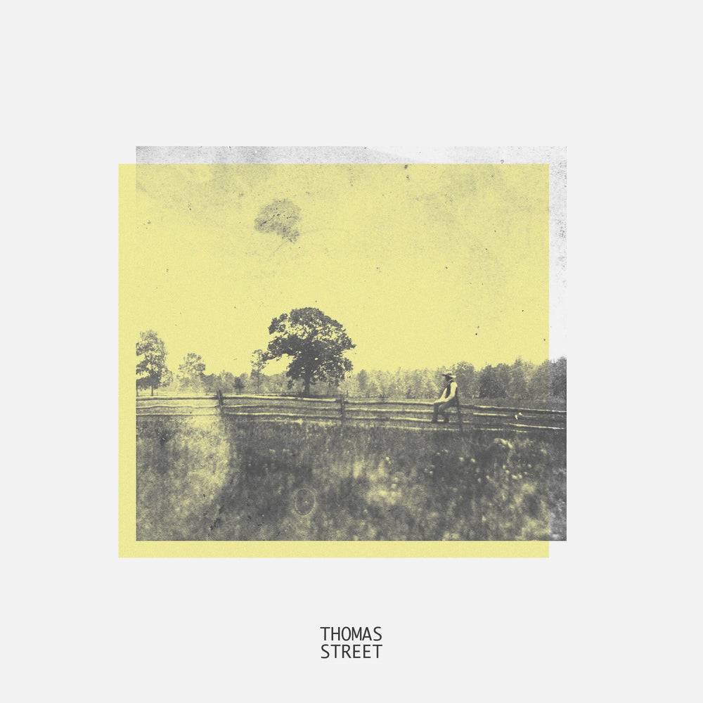 Album cover with a person sitting on a fence in a field, labeled 'Thomas Street'.