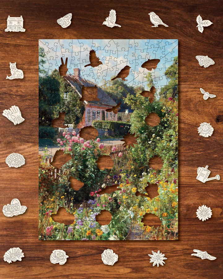 Jigsaw puzzle with garden scene on a wooden surface with puzzle pieces scattered around