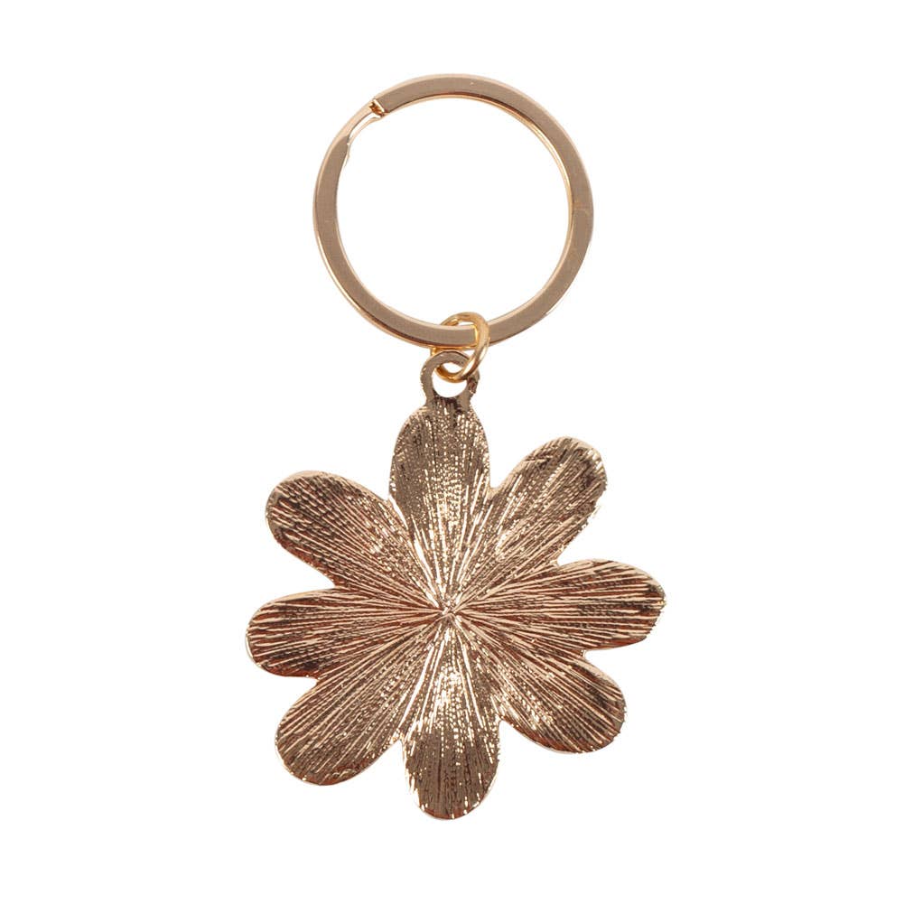Rose gold flower-shaped keychain on a white background