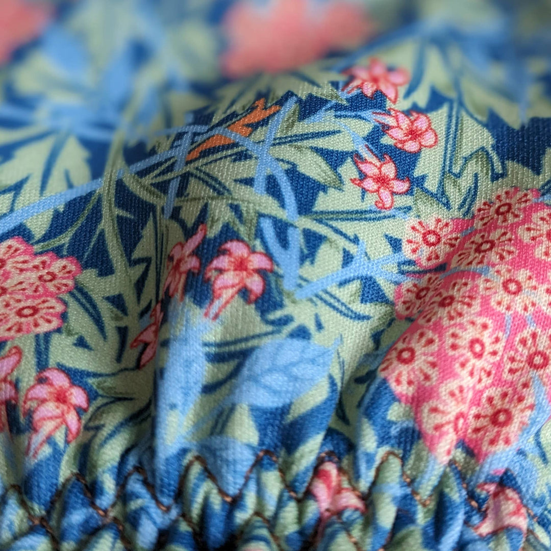 Close-up of fabric with floral and animal pattern